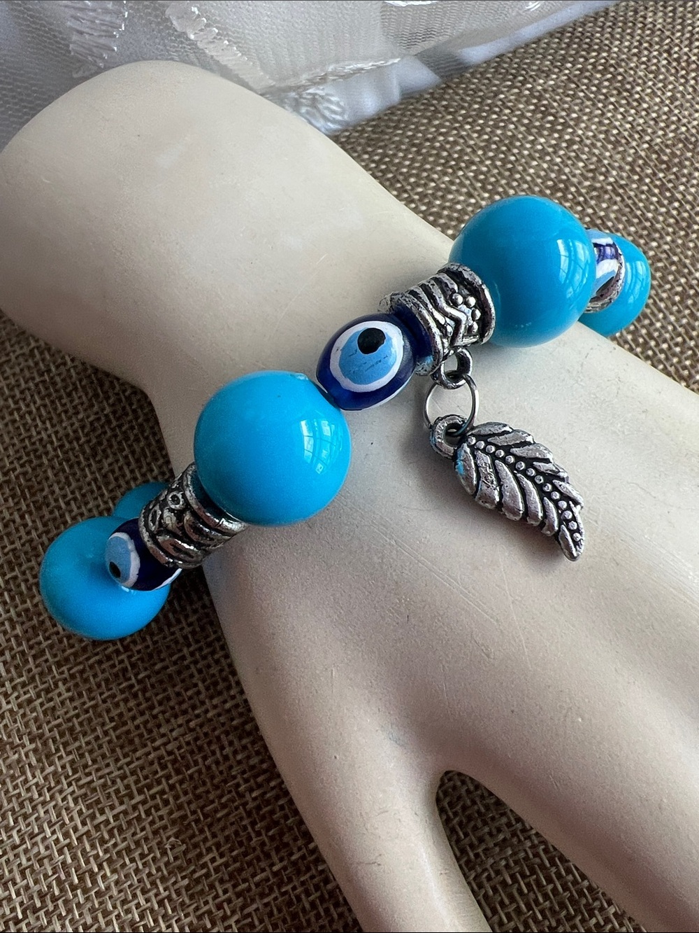 Turquoise Blue Evil Eye Bead Bracelet with Silver Leaf Charm